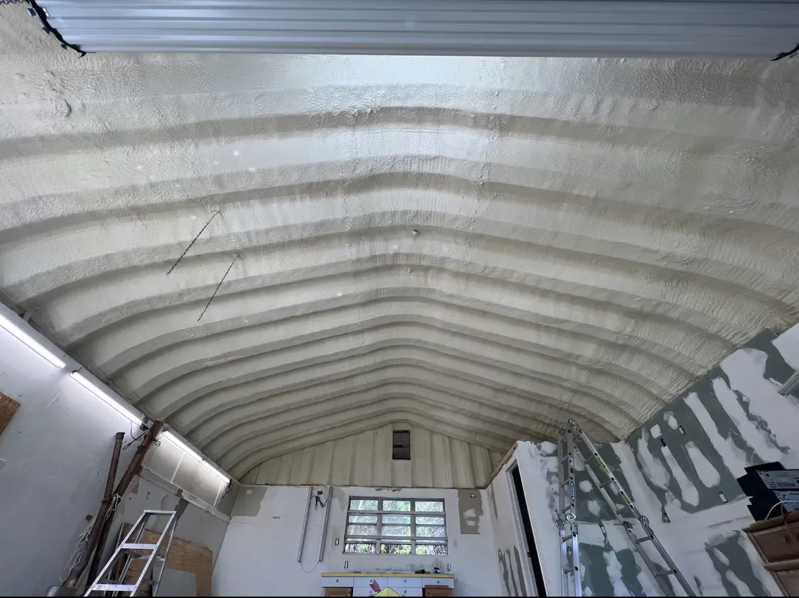Spray polyurethane foam applied to the underside of a metal roof deck in Canandaigua